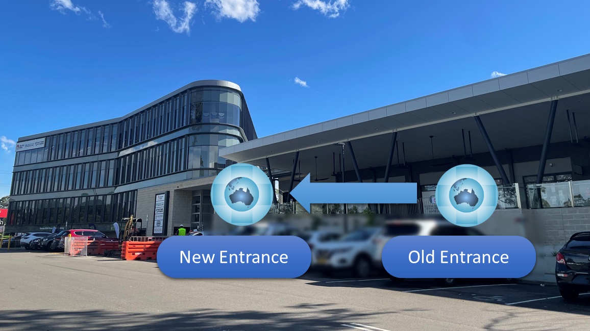 The old entrance and the new entrance photographed from the same car park, marked with arrows